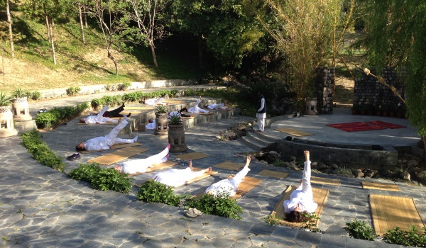 A yoga class at the outdoor amphitheathre at Ananda in the Himalayas