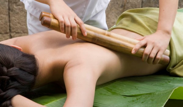 A bamboo massage at The Farm