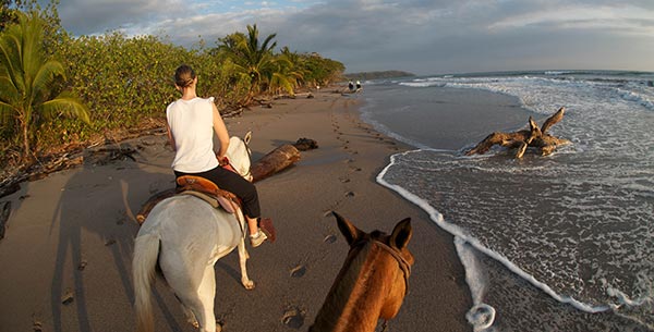 horse riding on the beach at florblanca