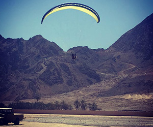 paragliding into zighy bay