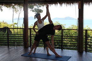 Paul practising yoga with Nok at Kamalaya, Thailand